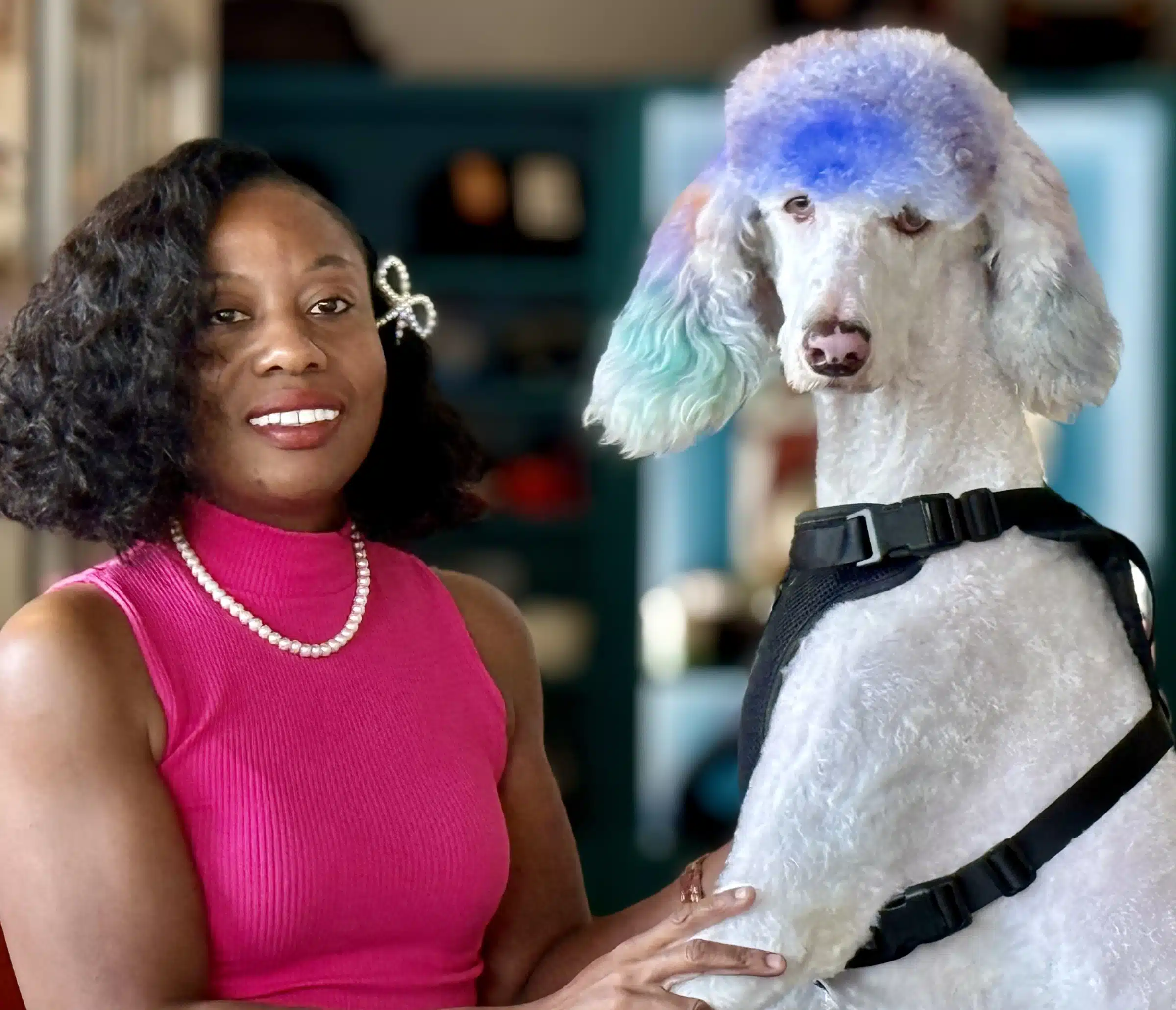 Our dog groomer, Ameenah Baaree, standing with a stylish purple-haired poodle